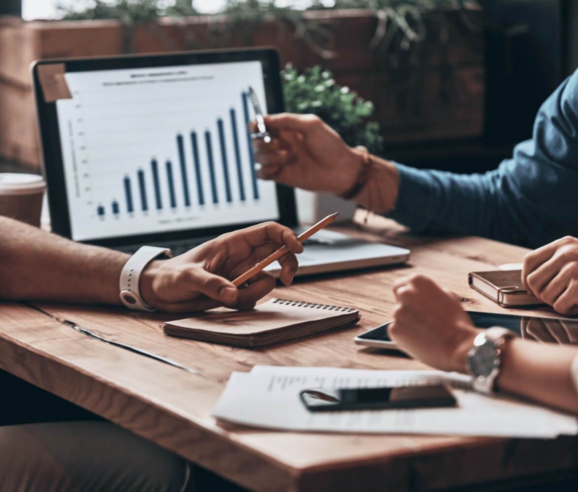 Close up of business people analyzing marketing data