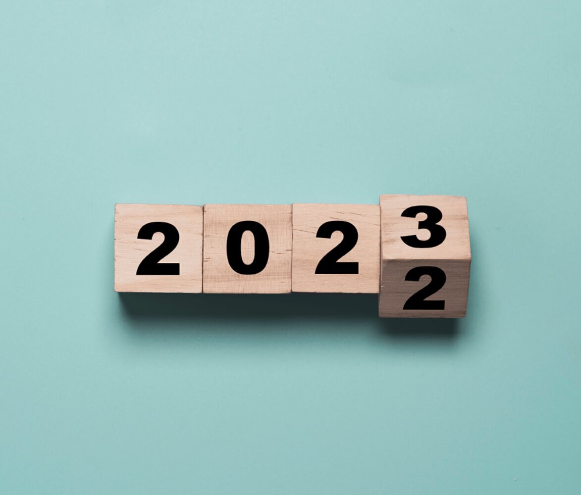 Four wooden Blocks with 2022, last number flipped to 3